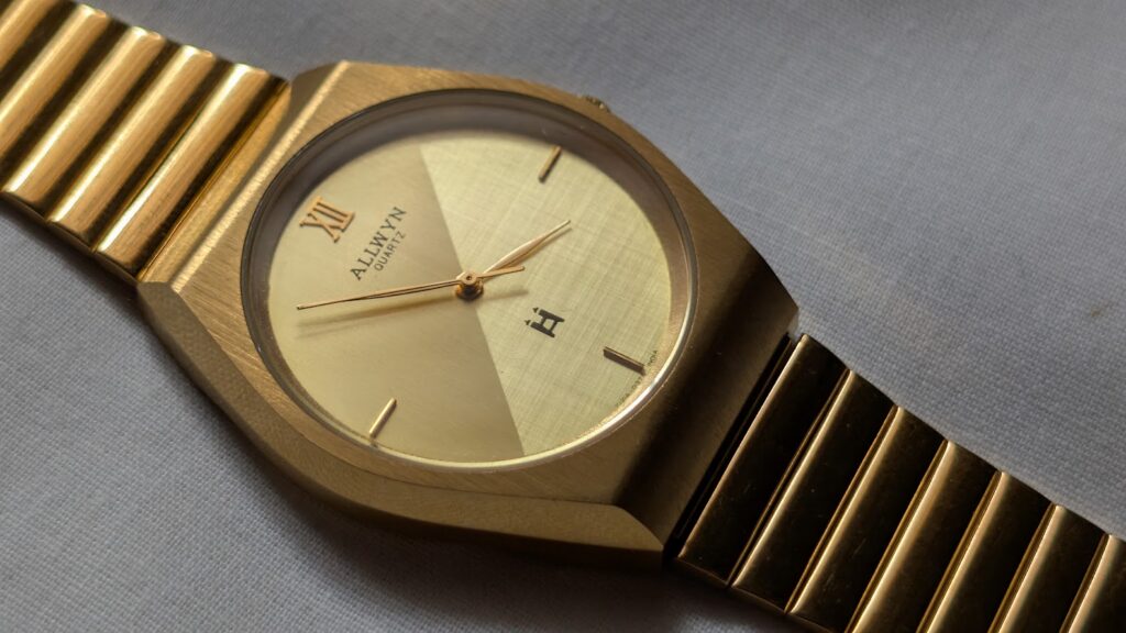 Allwyn Quartz Golden Dual tone dial, stylish yet elegant watch, soft lighting diagnoal shot showcasing the texture of the sophisticated dial design